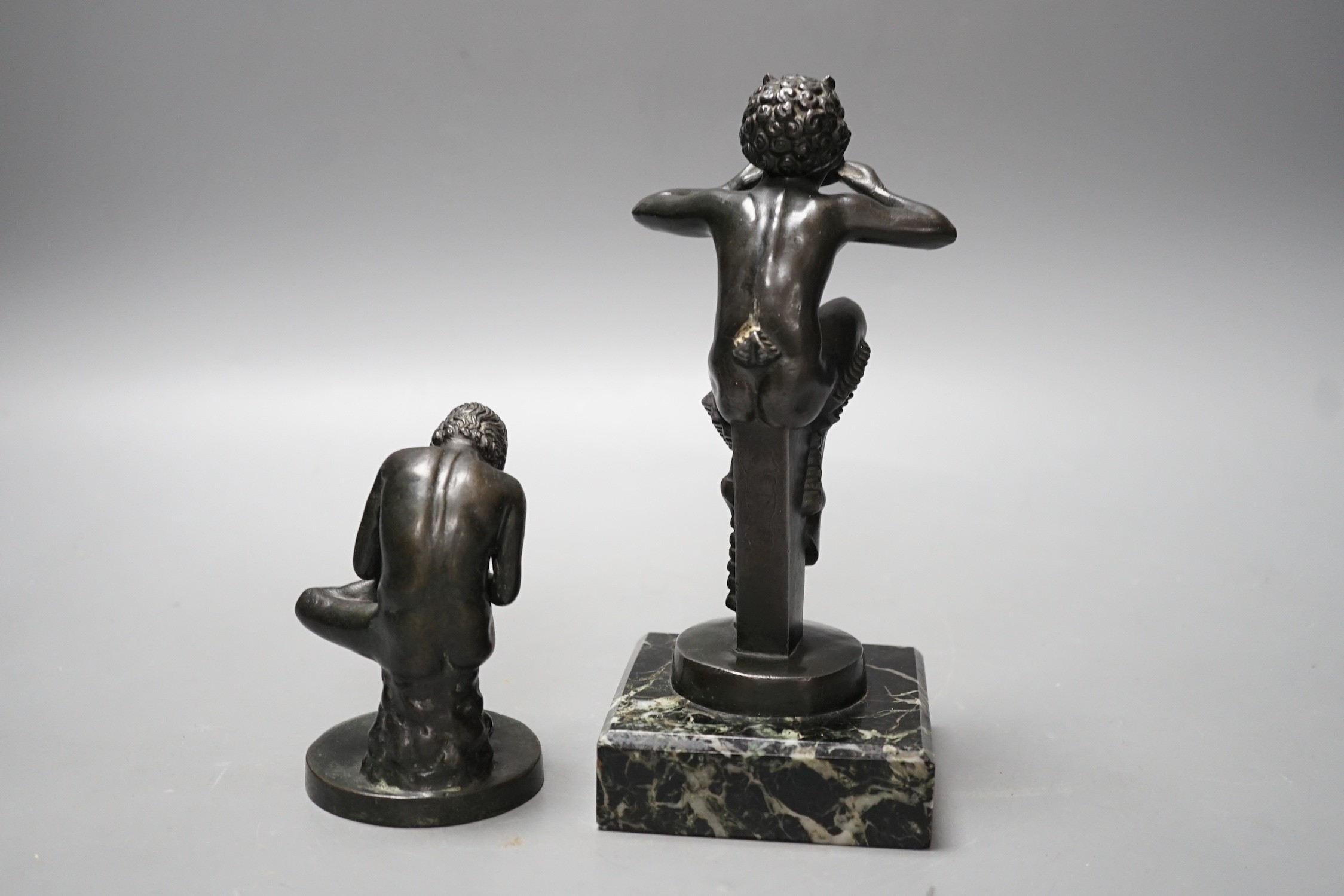 An early 20th century bronze figure of Pan on serpentine base and another of Spinario. Tallest 19cm